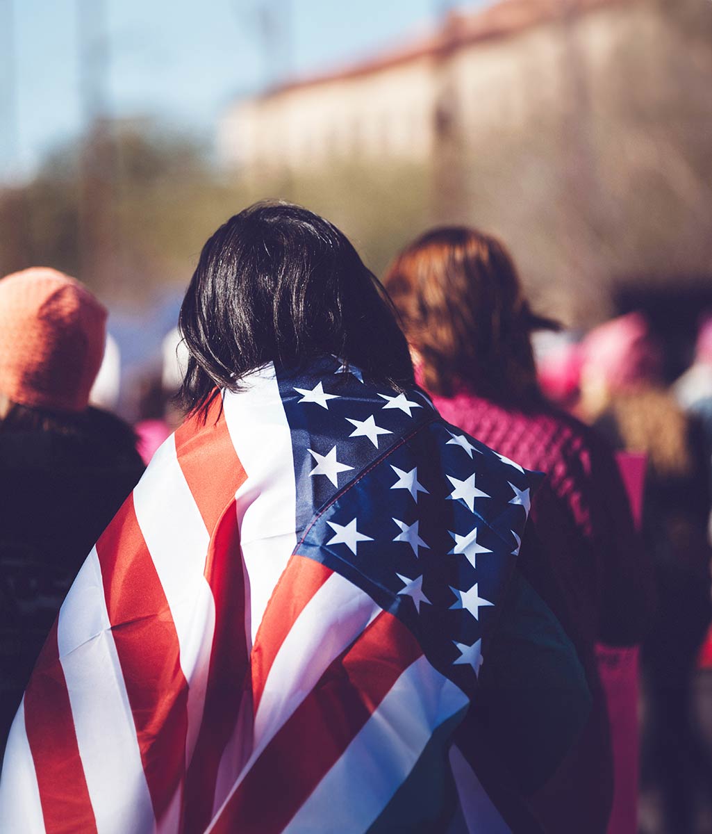 Person Carrying American Flag over their Back Person Carrying American Flag over their Back